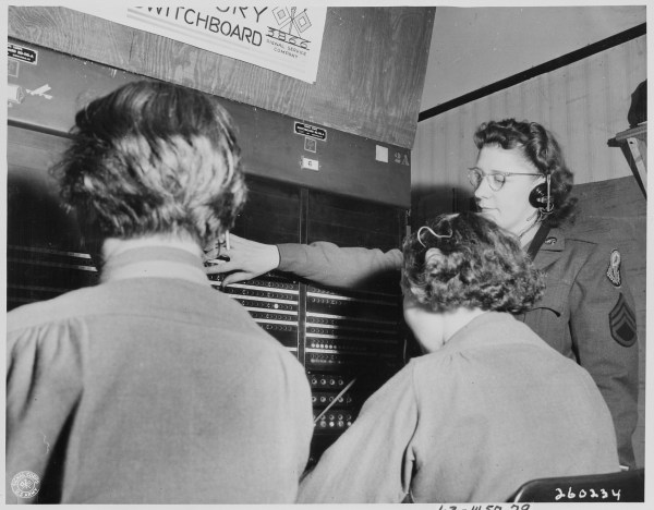S._Sgt._Lorraine_Robitaille,_switchboard_supervisor,_from_Duluth,_Minnesota,_looks_down_the_line_of_the_Victory..._-_NARA_-_199009